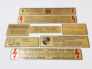 78 porsche 928 us gold metal foil sticker decal 92870116302 high voltage 92800610500 firing order 92800610105 emissions control 92800610300 ignition timing 92870115102 fan warning 9287015302 intensive washer 92800650800 tire pressure 92800650500 9287015502 battery cover 92870115702 spare tire pressure