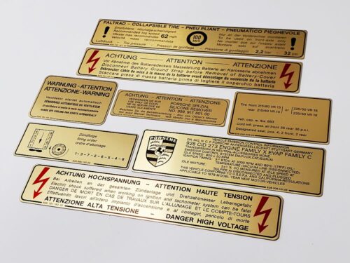 78 porsche 928 us gold metal foil sticker decal 92870116302 high voltage 92800610500 firing order 92800610105 emissions control 92800610300 ignition timing 92870115102 fan warning 9287015302 intensive washer 92800650800 tire pressure 92800650500 9287015502 battery cover 92870115702 spare tire pressure